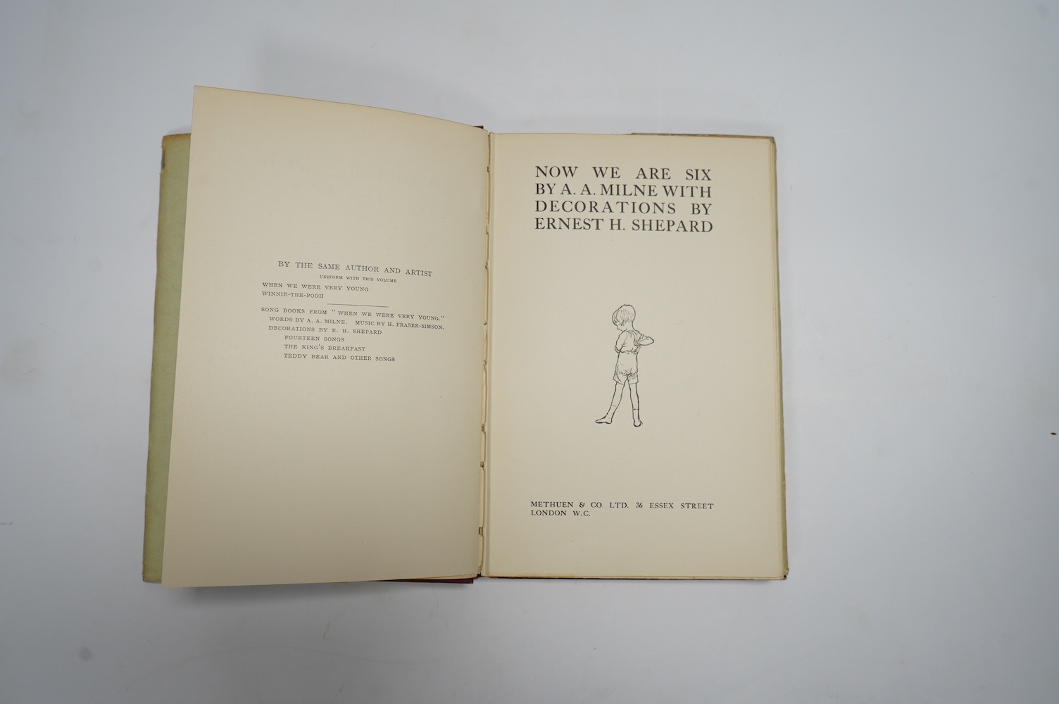 Milne, A.A. - Now We Are Six. With decorations by Ernest H. Shepard. First Edition. pictorial title and num. text illus and on e/ps.; original gilt ruled and pictorial red cloth, gilt top, in the pictorial d/wrapper, sm.